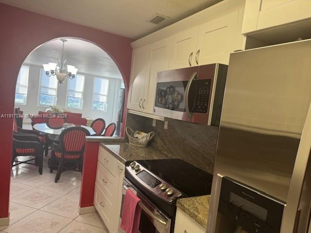5401 Collins Avenue, Unit 931 Miami Beach, FL 33140 - Photo 25 of 40 a room with chairs and washer