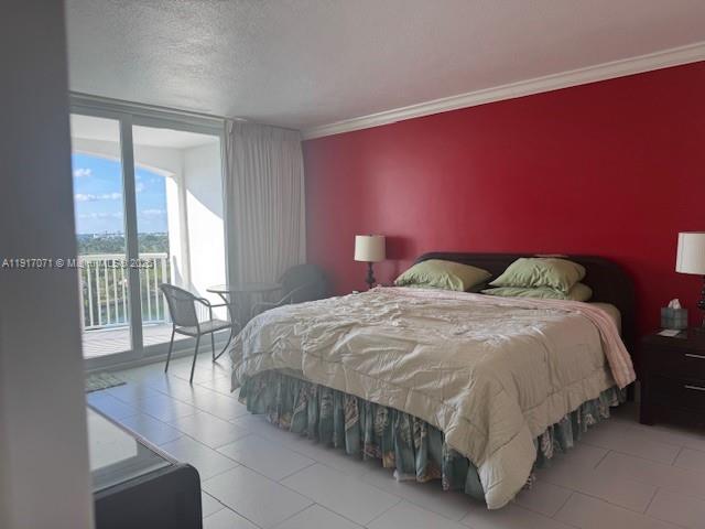5401 Collins Avenue, Unit 931 Miami Beach, FL 33140 - Photo 28 of 40 a bedroom with a bed and a table