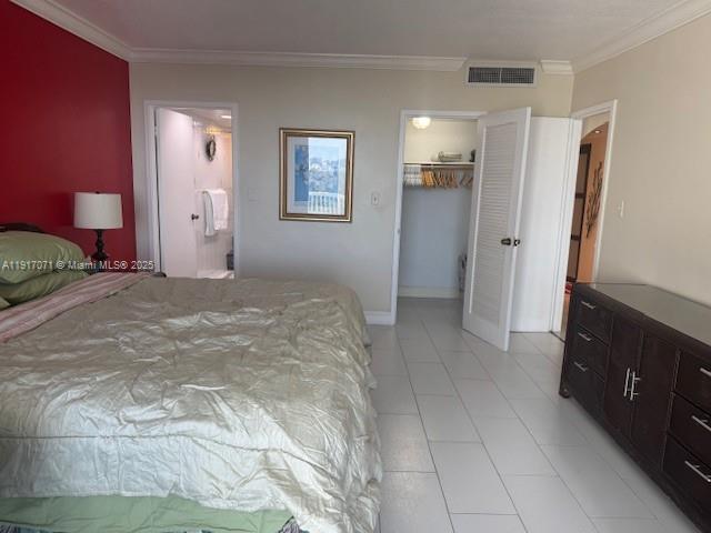 5401 Collins Avenue, Unit 931 Miami Beach, FL 33140 - Photo 29 of 40 a view of a bedroom with a bed and a bathroom