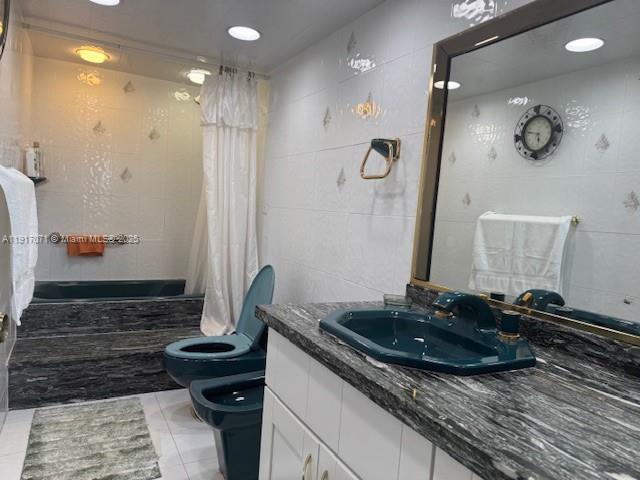 5401 Collins Avenue, Unit 931 Miami Beach, FL 33140 - Photo 30 of 40 a bathroom with a sink and a mirror
