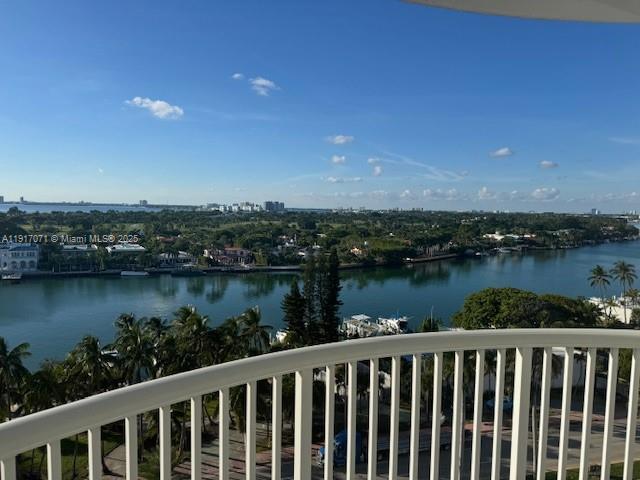 5401 Collins Avenue, Unit 931 Miami Beach, FL 33140 - Photo 35 of 40 a balcony with wooden floor and lake view