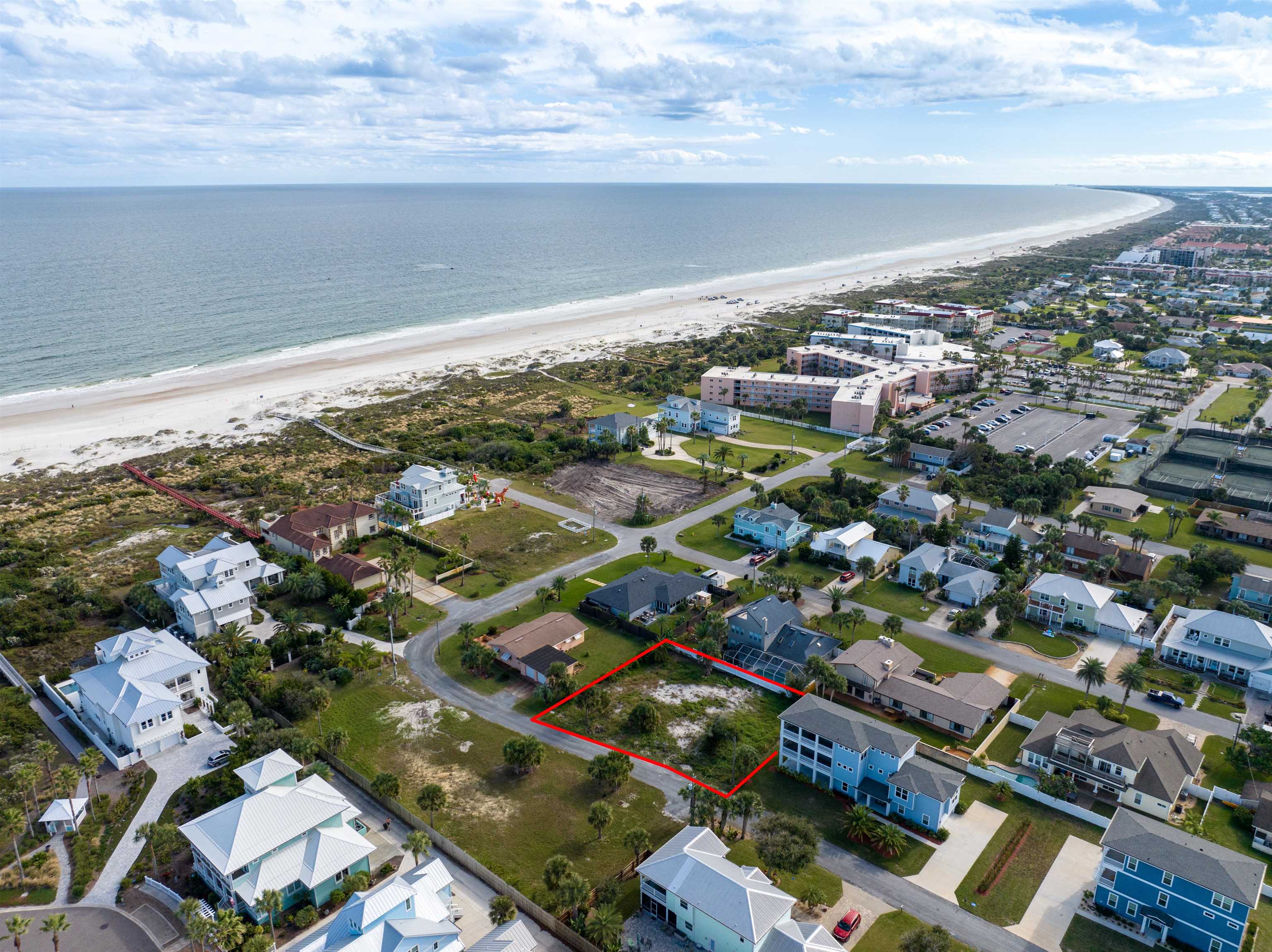 23 Oceanside Circle St. Augustine, FL 32080 - Photo 1 of 22 an aerial view of a city with lots of residential buildings and ocean view in back