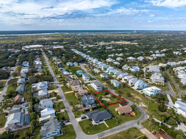 an aerial view of residential building with green space