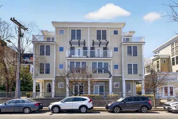 a view of a car parked in front of a building