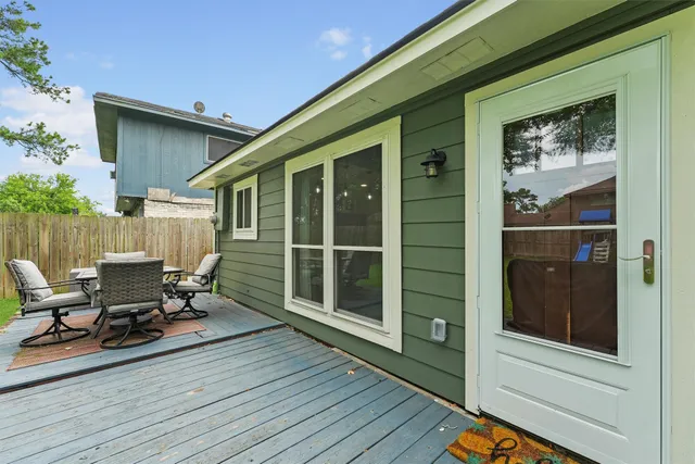 a view of a two chairs in the balcony
