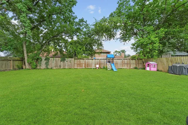a view of a park with large trees