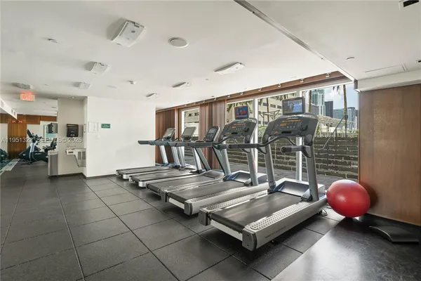 a living room with furniture a table and chairs