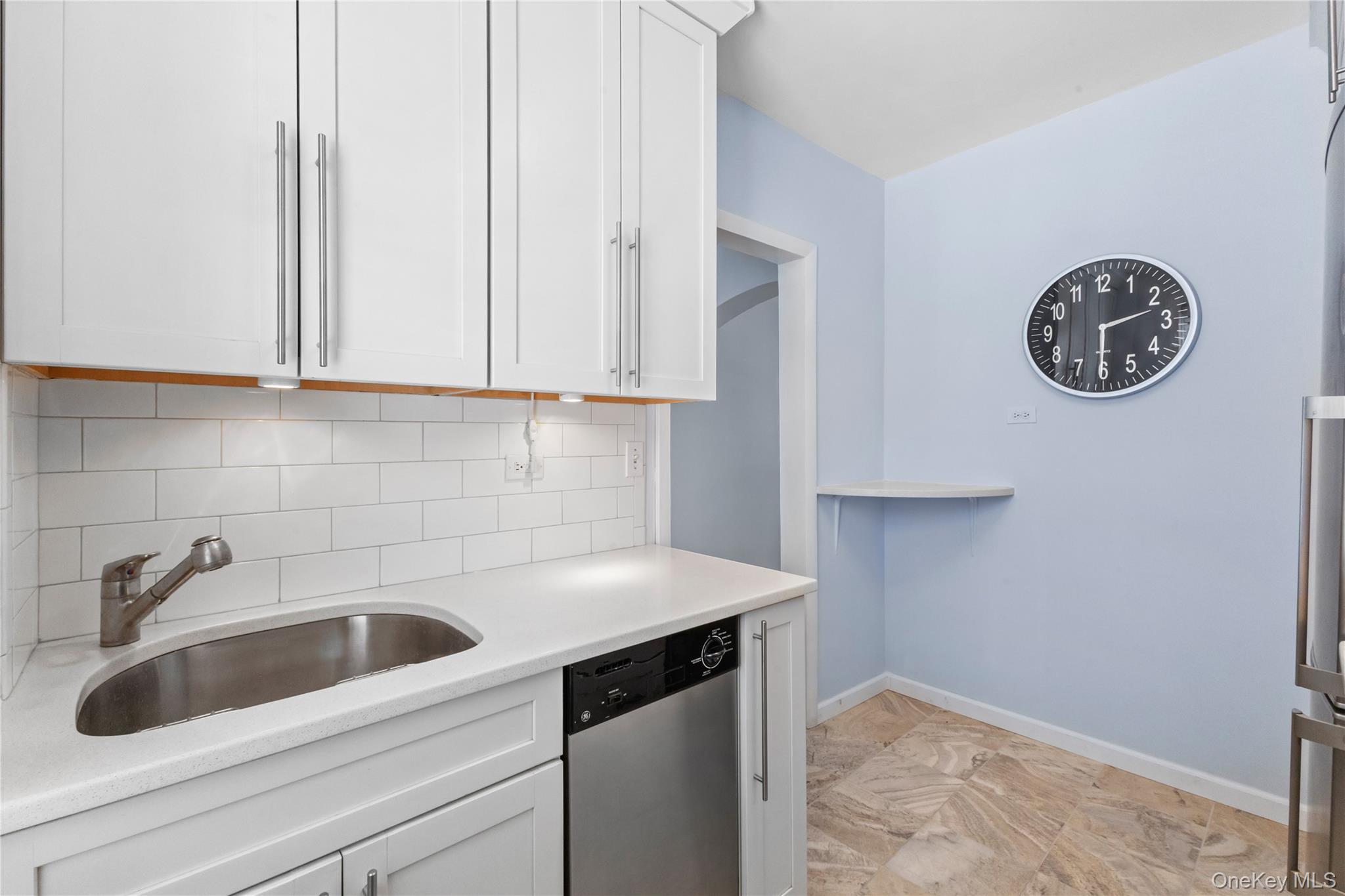 74 Pinewood Road, Unit 2F Hartsdale, NY 10530 - Photo 13 of 29 a view with a sink and cabinets