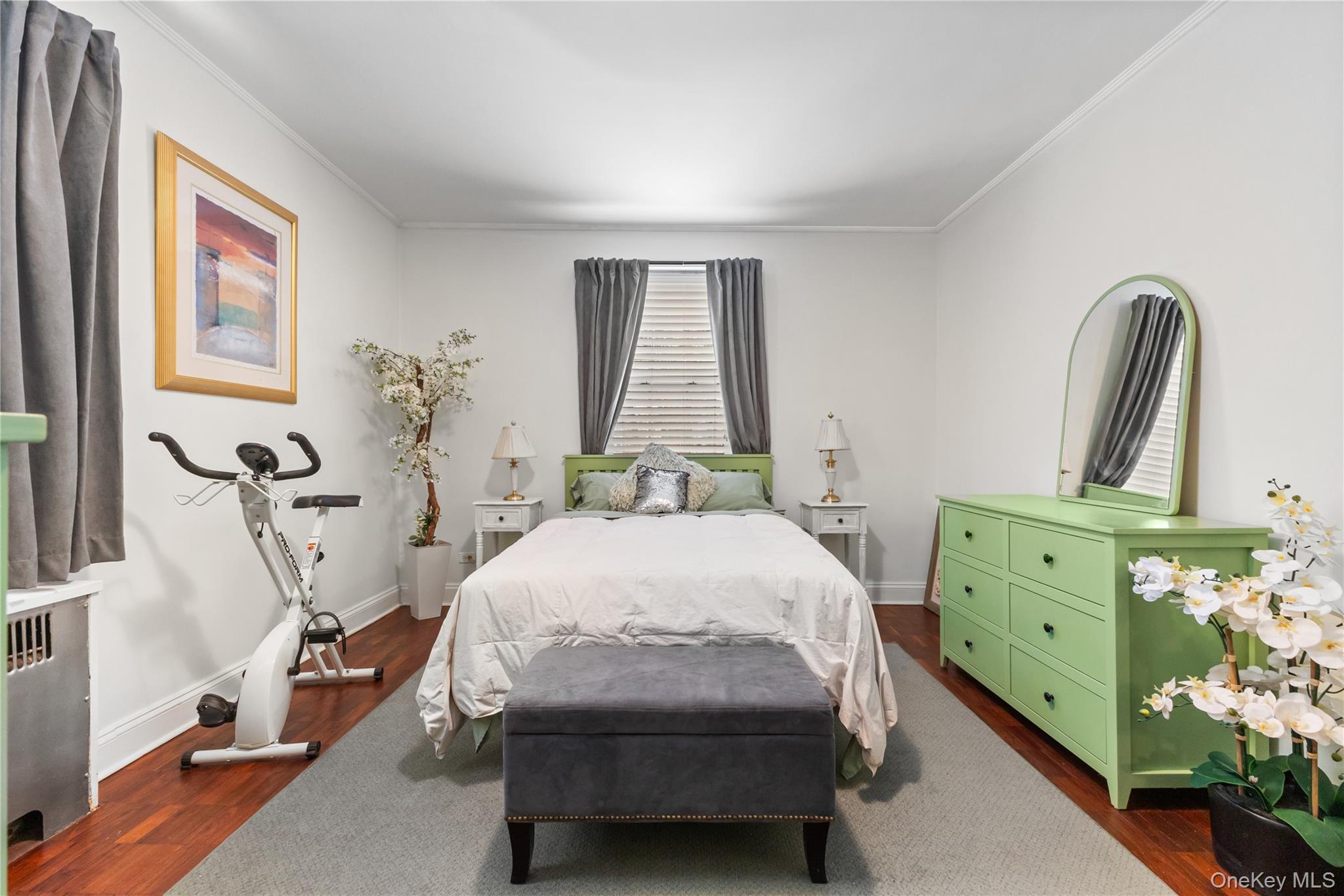 74 Pinewood Road, Unit 2F Hartsdale, NY 10530 - Photo 19 of 29 a bedroom with a bed and a dresser