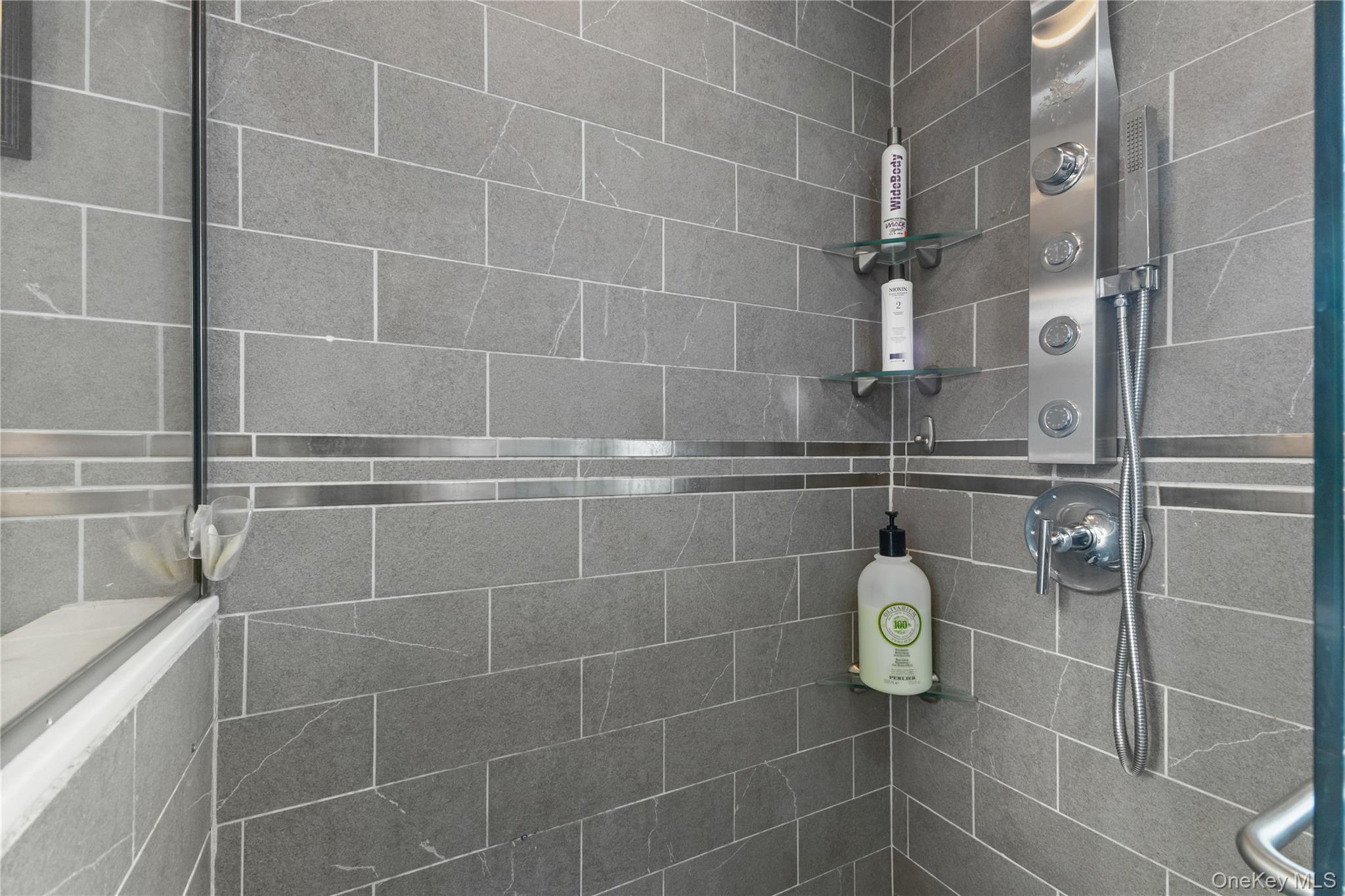 74 Pinewood Road, Unit 2F Hartsdale, NY 10530 - Photo 21 of 29 a bathroom with a shower