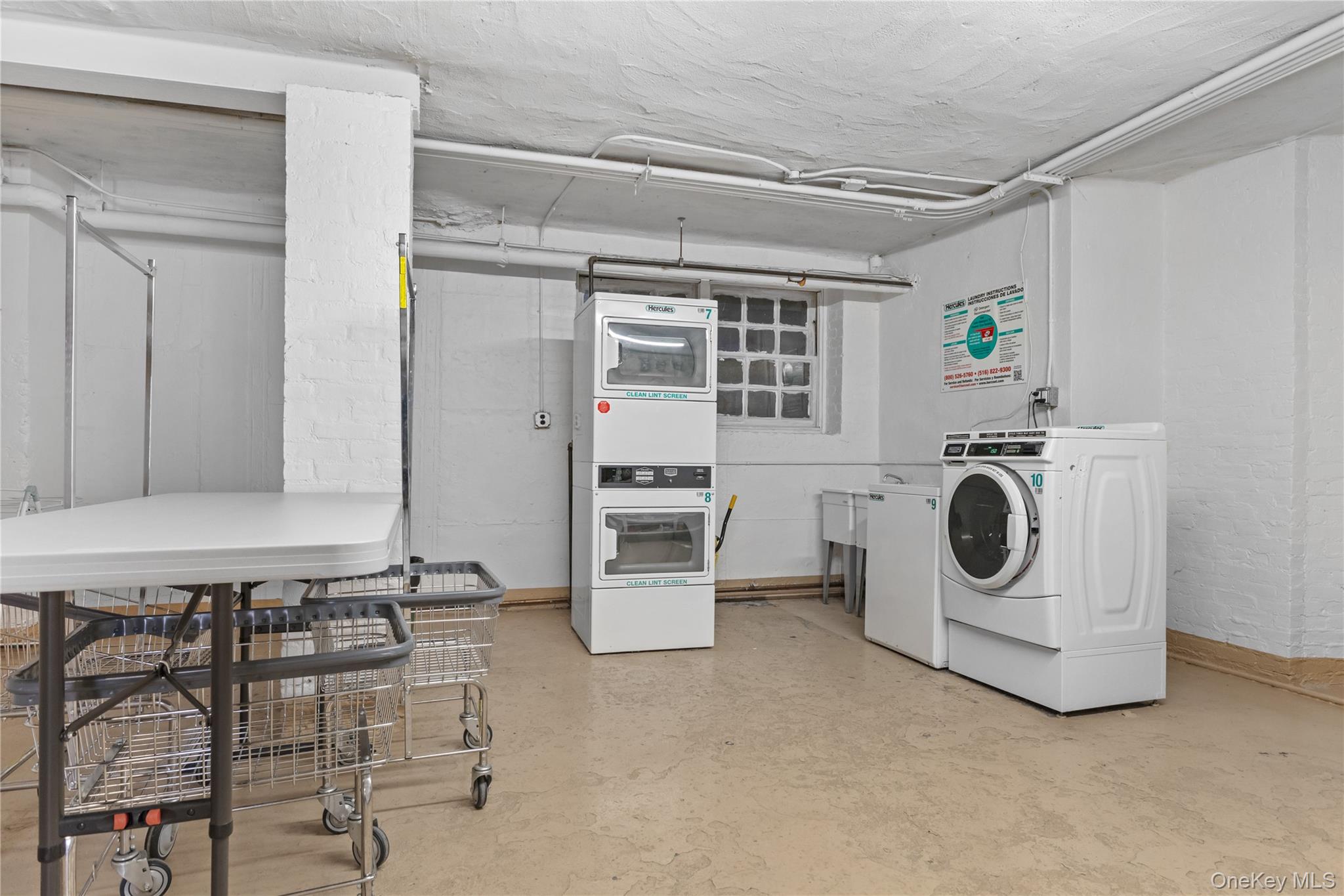74 Pinewood Road, Unit 2F Hartsdale, NY 10530 - Photo 24 of 29 a utility room with dryer and washer