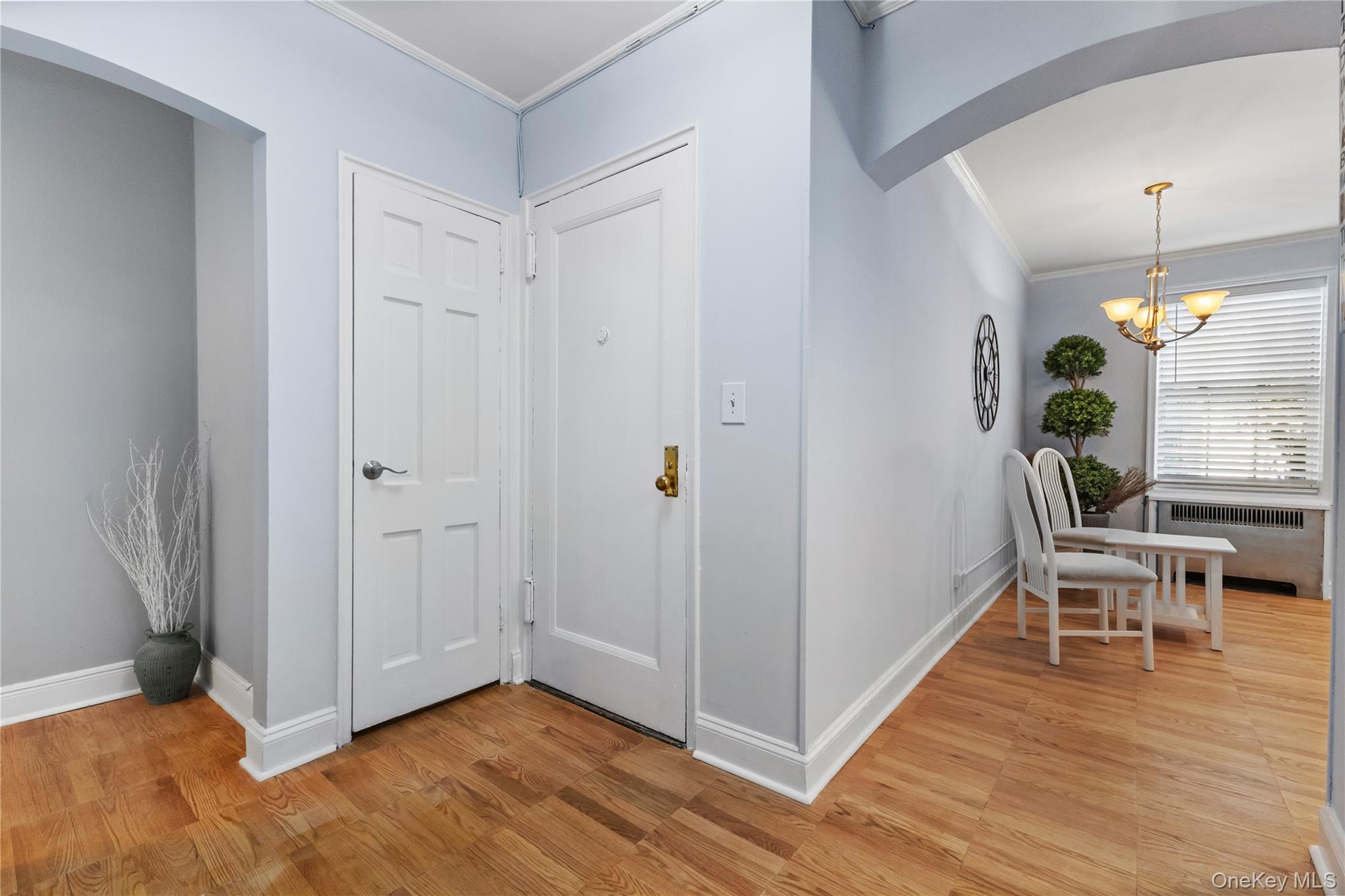 74 Pinewood Road, Unit 2F Hartsdale, NY 10530 - Photo 3 of 29 a view of a dining room with furniture window and wooden floor