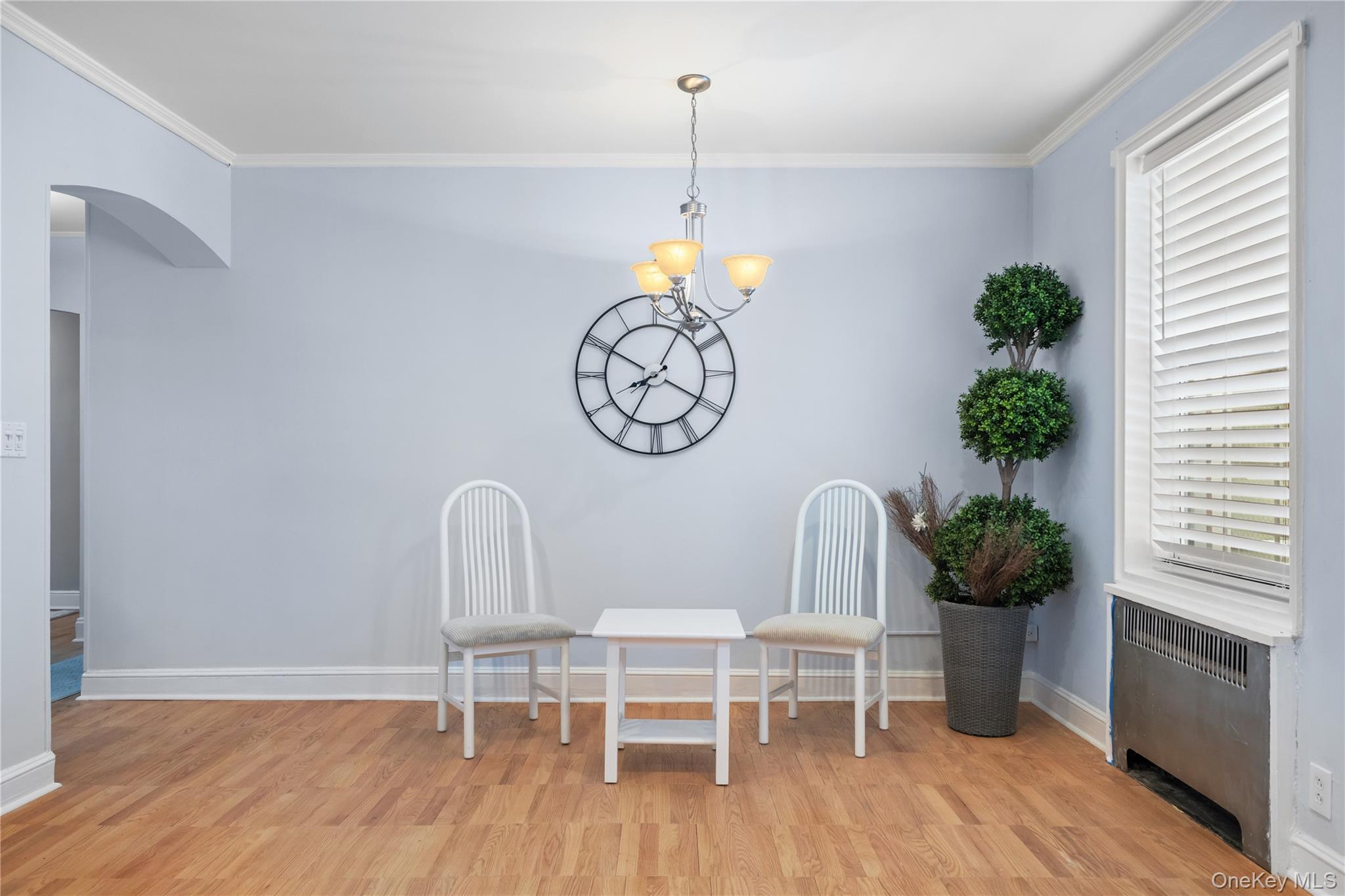 74 Pinewood Road, Unit 2F Hartsdale, NY 10530 - Photo 9 of 29 a dining room with furniture and a wooden floor