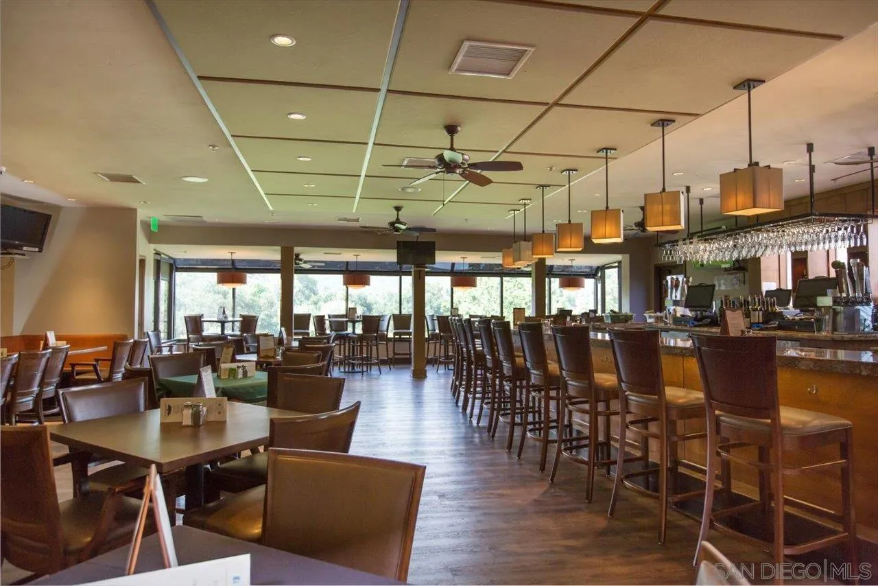 16109 Watt Way Ramona, CA 92065 - Photo 45 of 51 a view of a dining room with lots of furniture and wooden floor