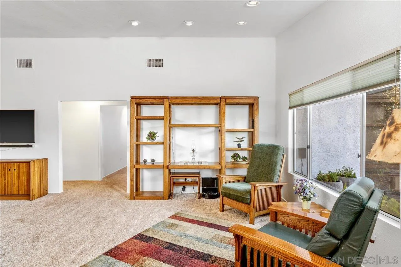 16109 Watt Way Ramona, CA 92065 - Photo 5 of 51 a living room with furniture and a flat screen tv