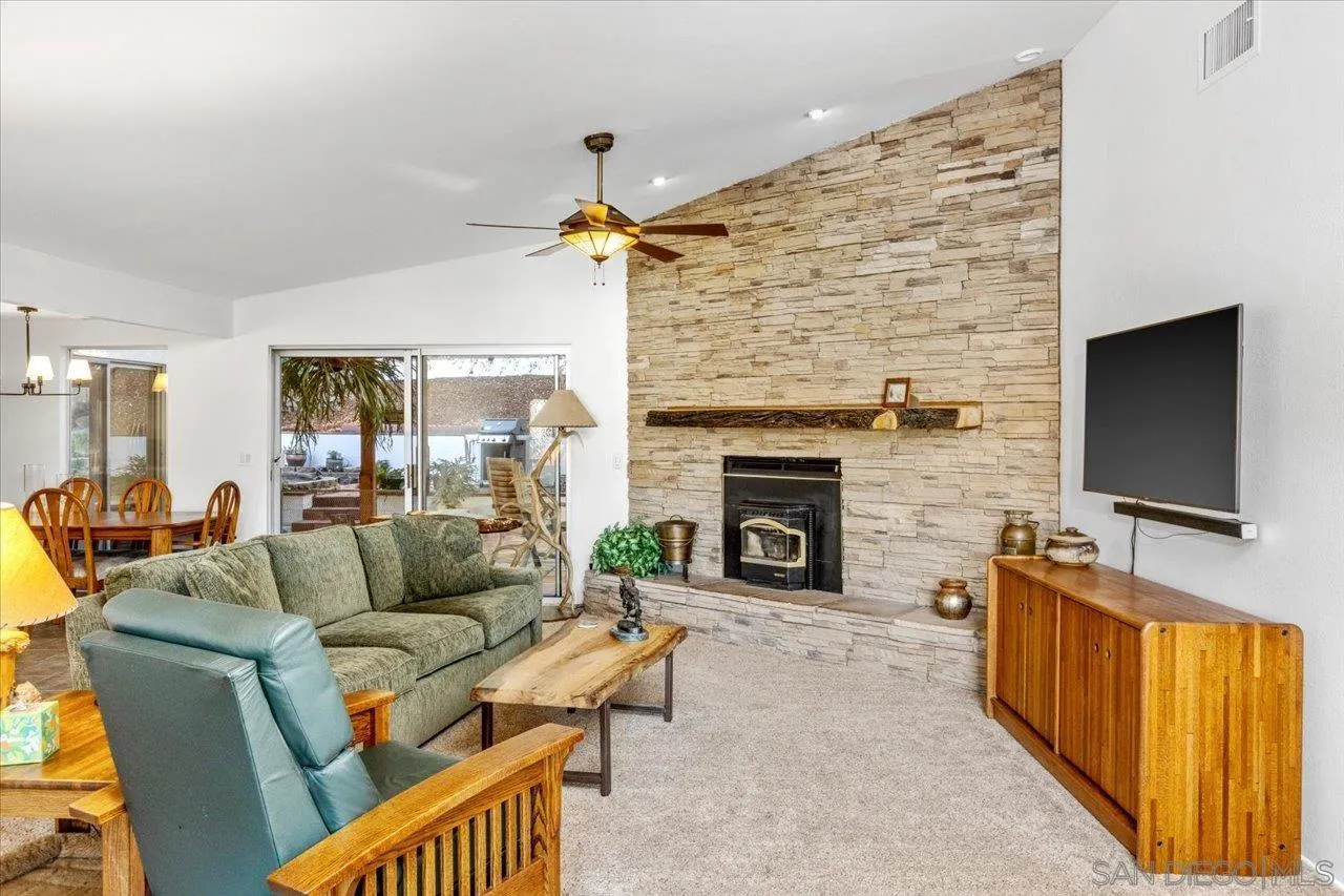 16109 Watt Way Ramona, CA 92065 - Photo 7 of 51 a living room with furniture and a flat screen tv