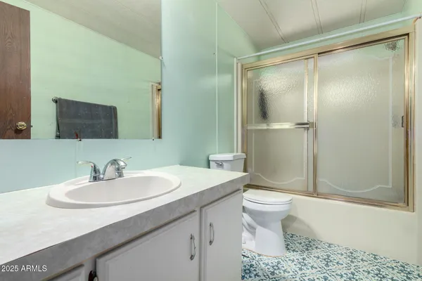 a kitchen with stainless steel appliances a refrigerator sink and cabinets
