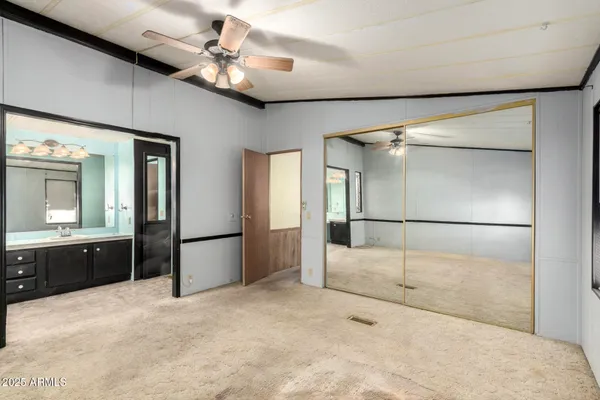 a kitchen with sink cabinets and microwave