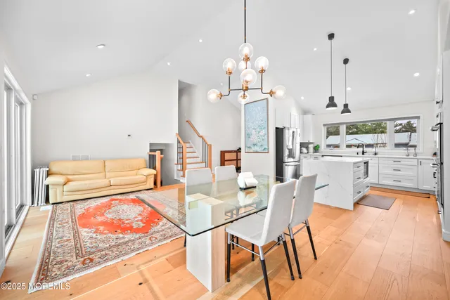 a very nice looking dining room with a table and chairs