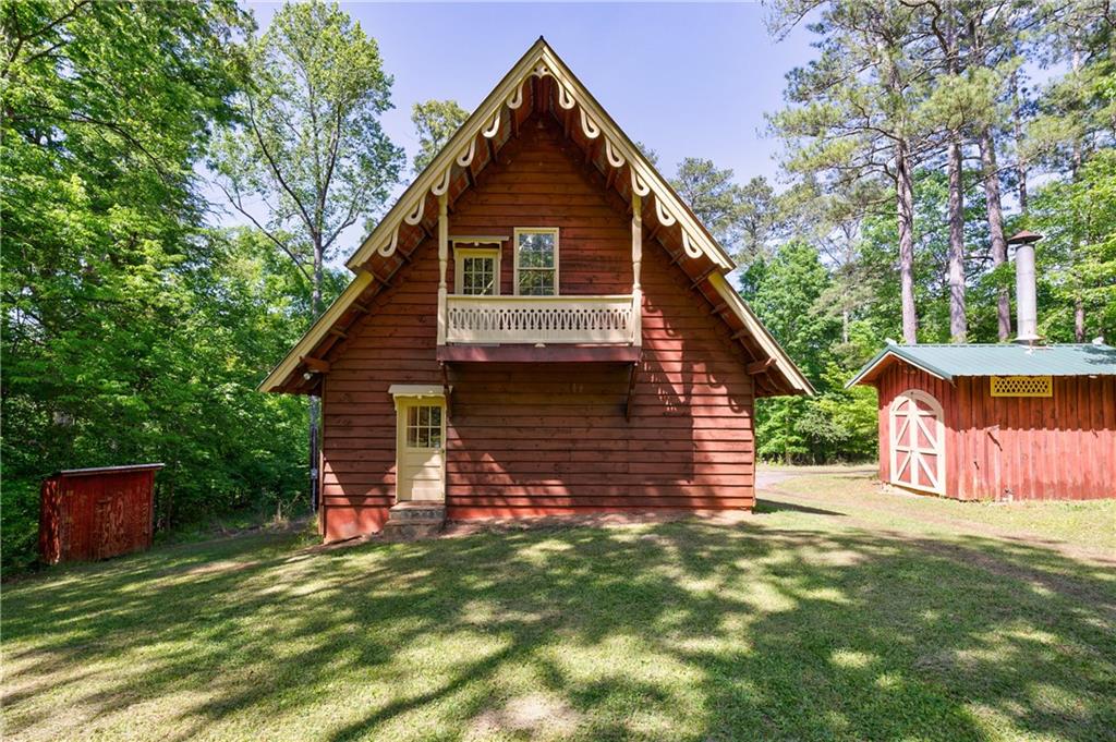 1560 Chubb Drive Southwest Cave Spring, GA 30124 - Photo 1 of 1 a front view of a house with a garden