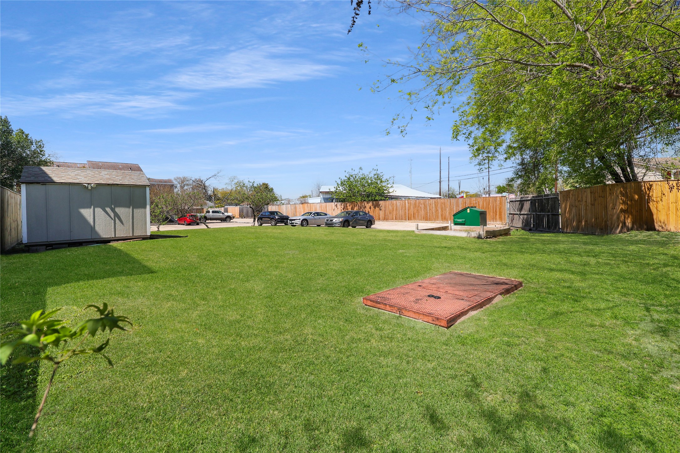 4501 North Main Street Houston, TX 77009 - Photo 6 of 12 a view of a backyard with plants and large trees