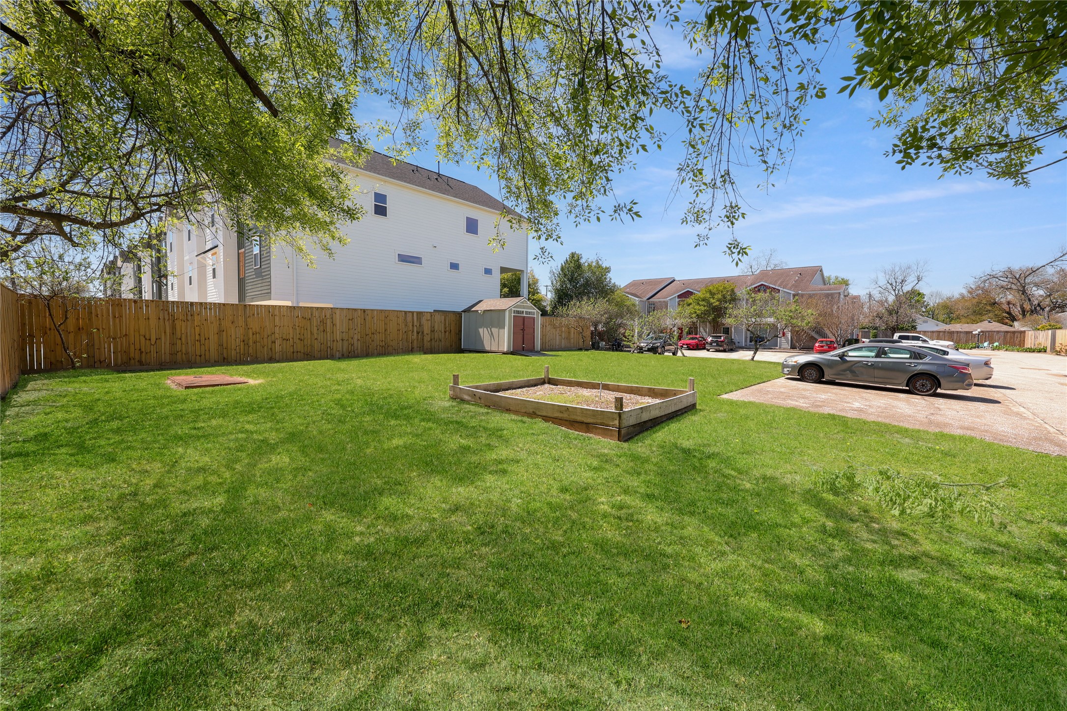 4501 North Main Street Houston, TX 77009 - Photo 7 of 12 a view of a backyard with large trees