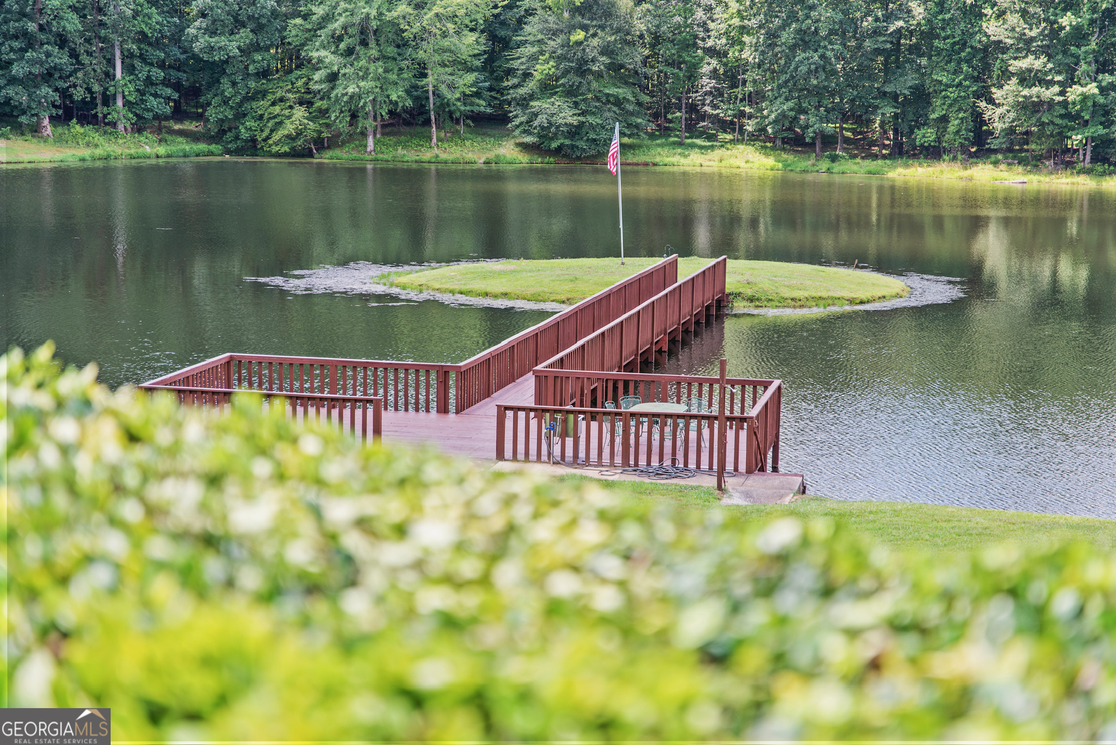 0 Doster Road, Unit 2720 Madison, GA 30650 - Photo 27 of 62 a view of a lake with a wooden deck