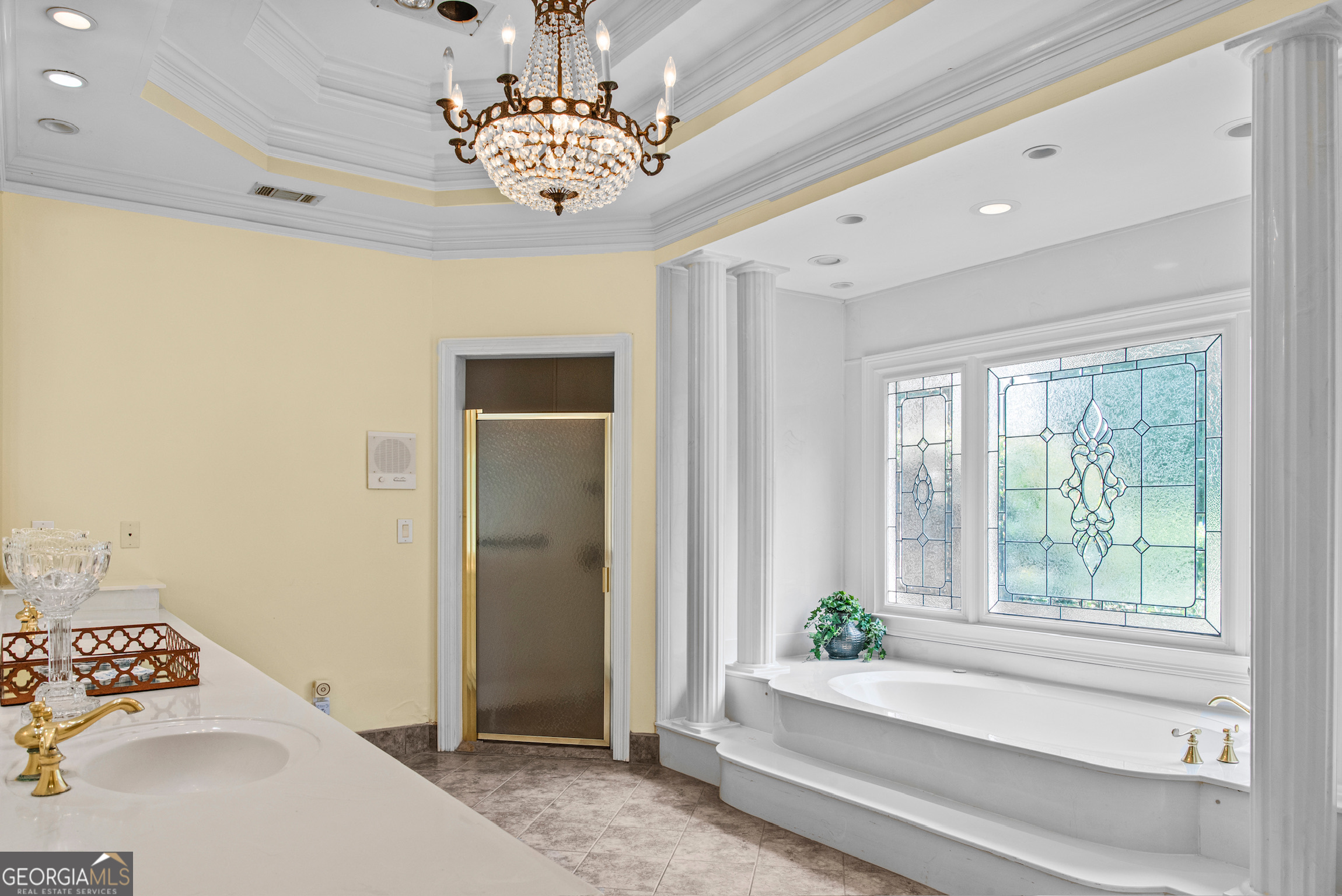 0 Doster Road, Unit 2720 Madison, GA 30650 - Photo 47 of 62 a bedroom with a bed and a chandelier