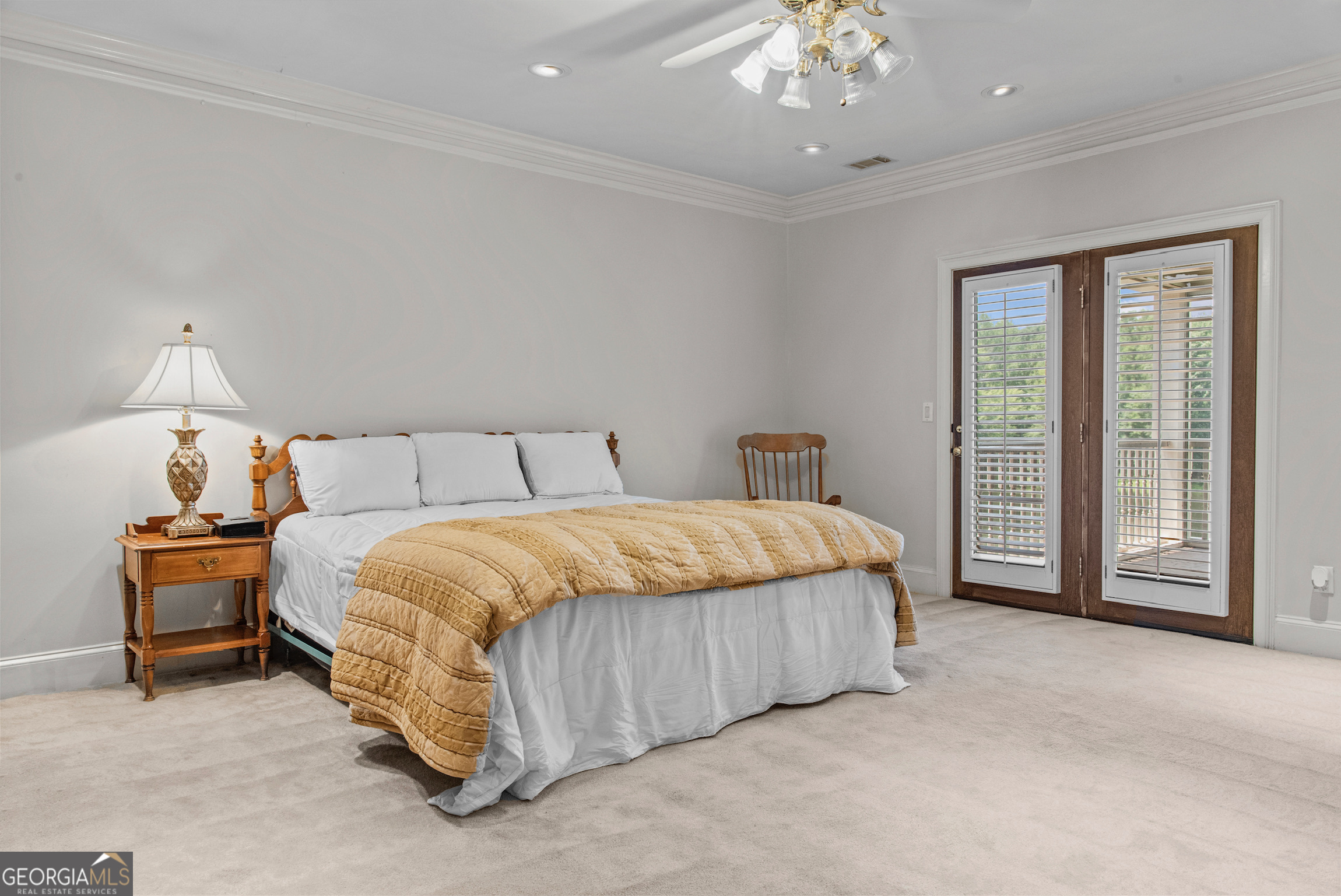 0 Doster Road, Unit 2720 Madison, GA 30650 - Photo 53 of 62 a bedroom with a bed and a chandelier