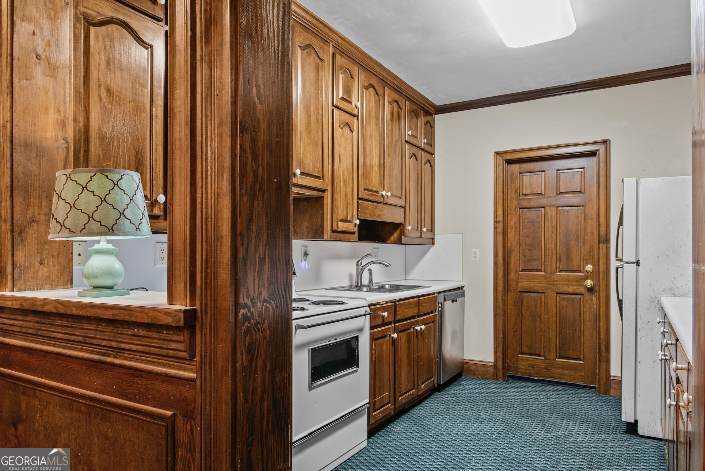 0 Doster Road, Unit 2720 Madison, GA 30650 - Photo 58 of 62 a kitchen with stainless steel appliances a refrigerator and cabinets