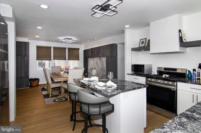 a dining room with furniture and window