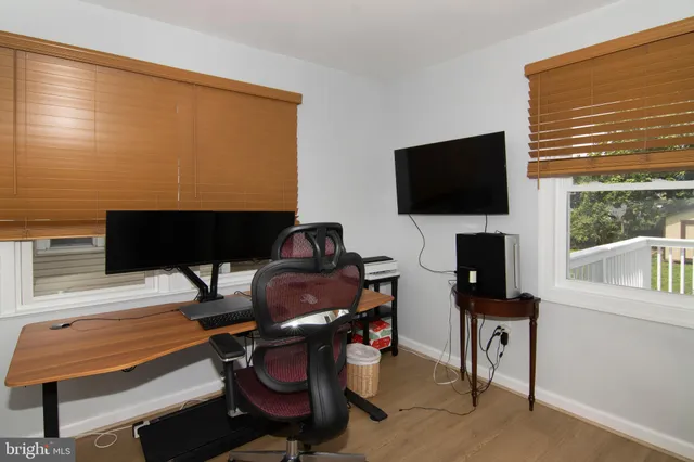 a bathroom with a sink vanity mirror and toilet