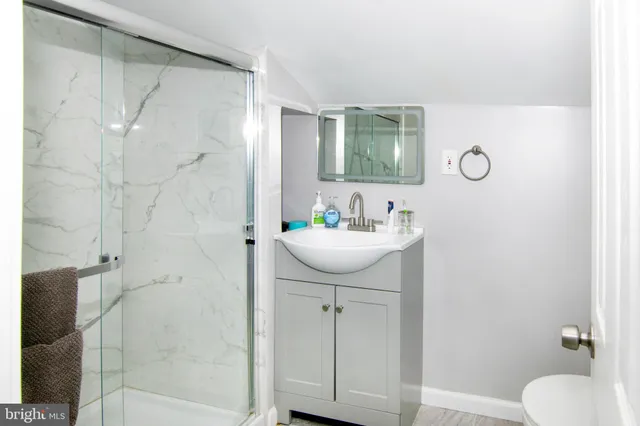 a bathroom with a tub and sink