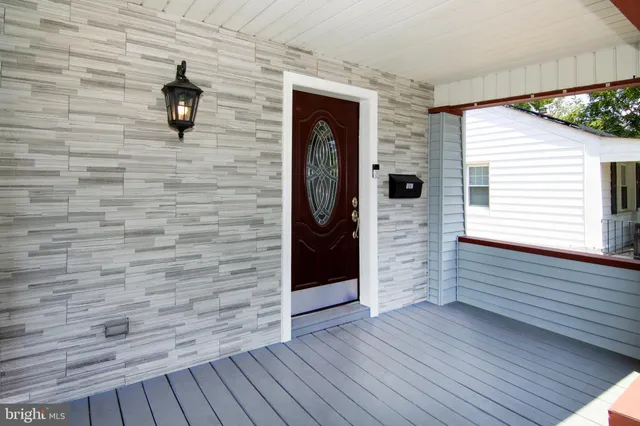 a view of an entryway door with wooden floor