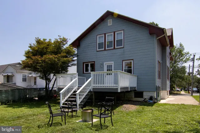 a view of a table and chairs in the garden