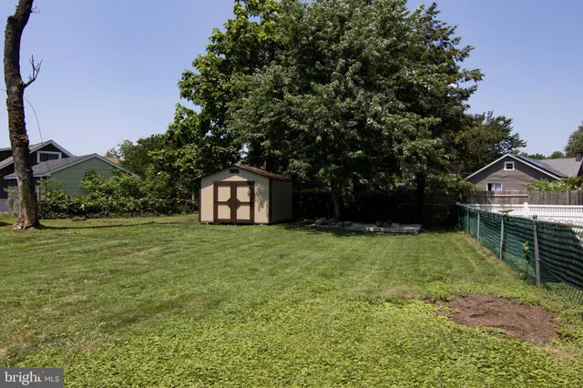 a front view of a house with swimming pool and porch