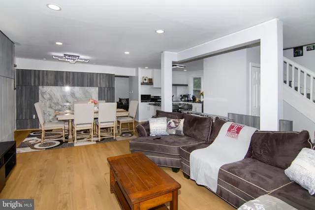 a living room with furniture and a table