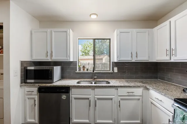 a bathroom with a sink and shower