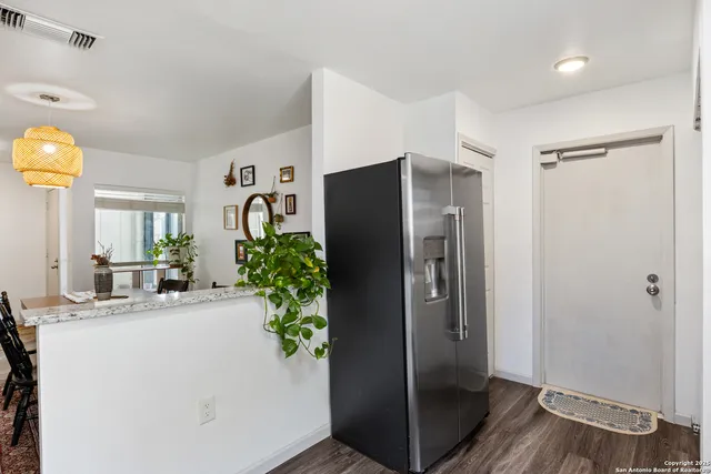 a view of a livingroom with furniture and a fireplace
