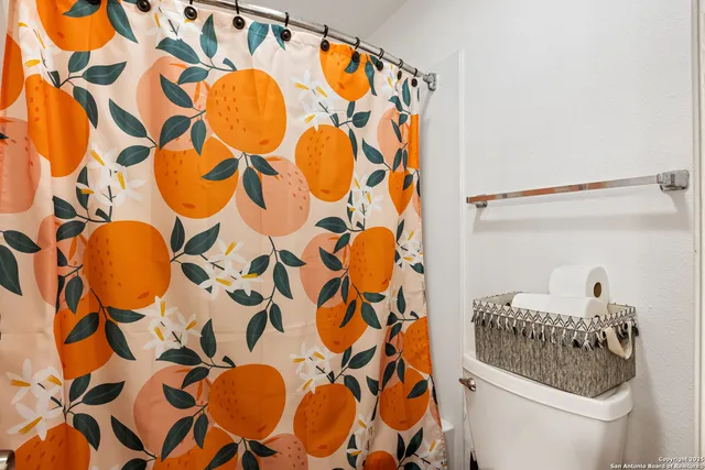 a bedroom with a bed and a desk