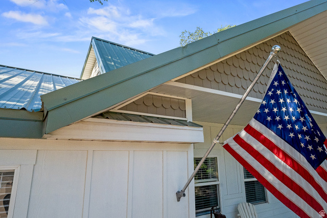 236 West 300 South Hurricane, UT 84737 - Photo 72 of 76 Exterior featuring a metal roof, scalloped siding, and white board-and-batten style siding