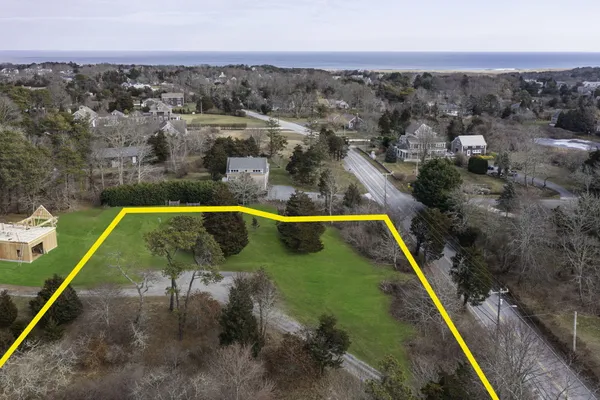 an aerial view of a house with a swimming pool