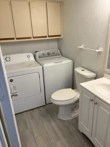 a bathroom with a toilet and a sink