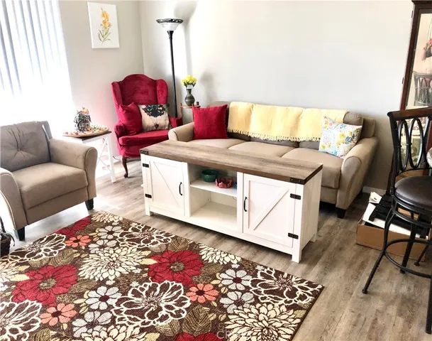 a living room with furniture and a rug
