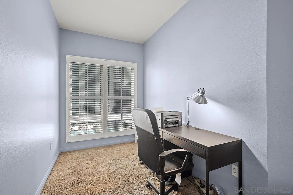 450 J Street, Unit 7071 San Diego, CA 92101 - Photo 15 of 33 a view of a workspace with furniture and a window
