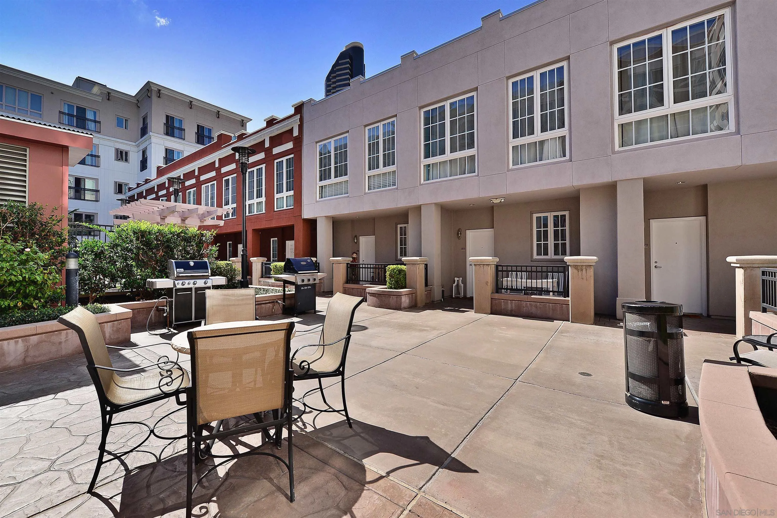 450 J Street, Unit 7071 San Diego, CA 92101 - Photo 26 of 33 a patio with a table and chairs