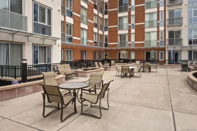 a view of a swimming pool with outdoor seating
