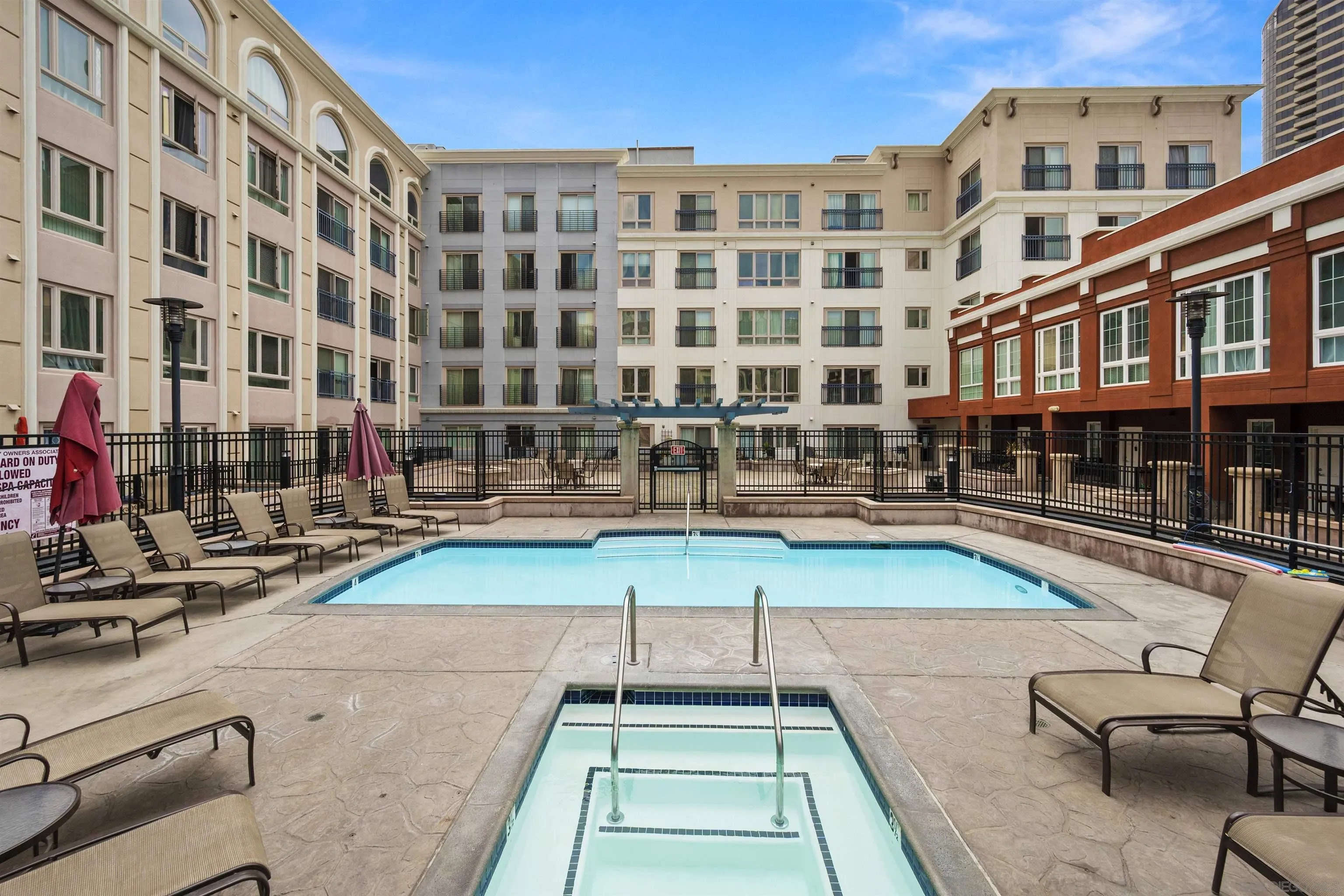 450 J Street, Unit 7071 San Diego, CA 92101 - Photo 30 of 33 a view of a swimming pool with a lounge chairs