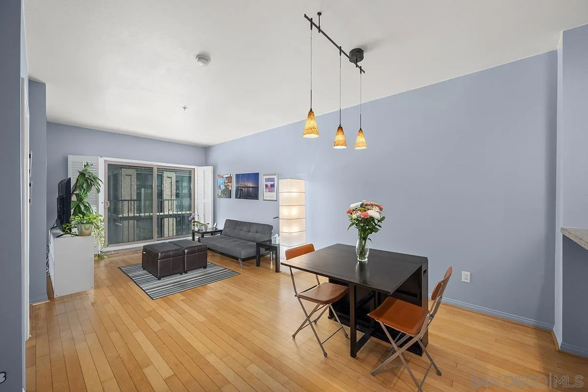 450 J Street, Unit 7071 San Diego, CA 92101 - Photo 5 of 33 a living room with furniture and wooden floor
