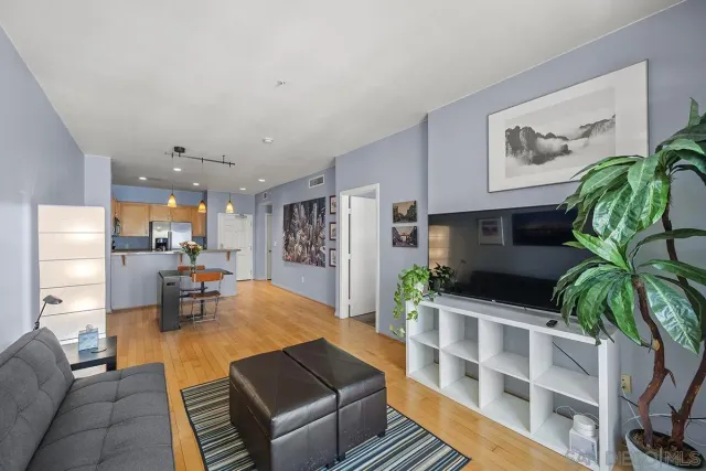 a kitchen with sink refrigerator and microwave